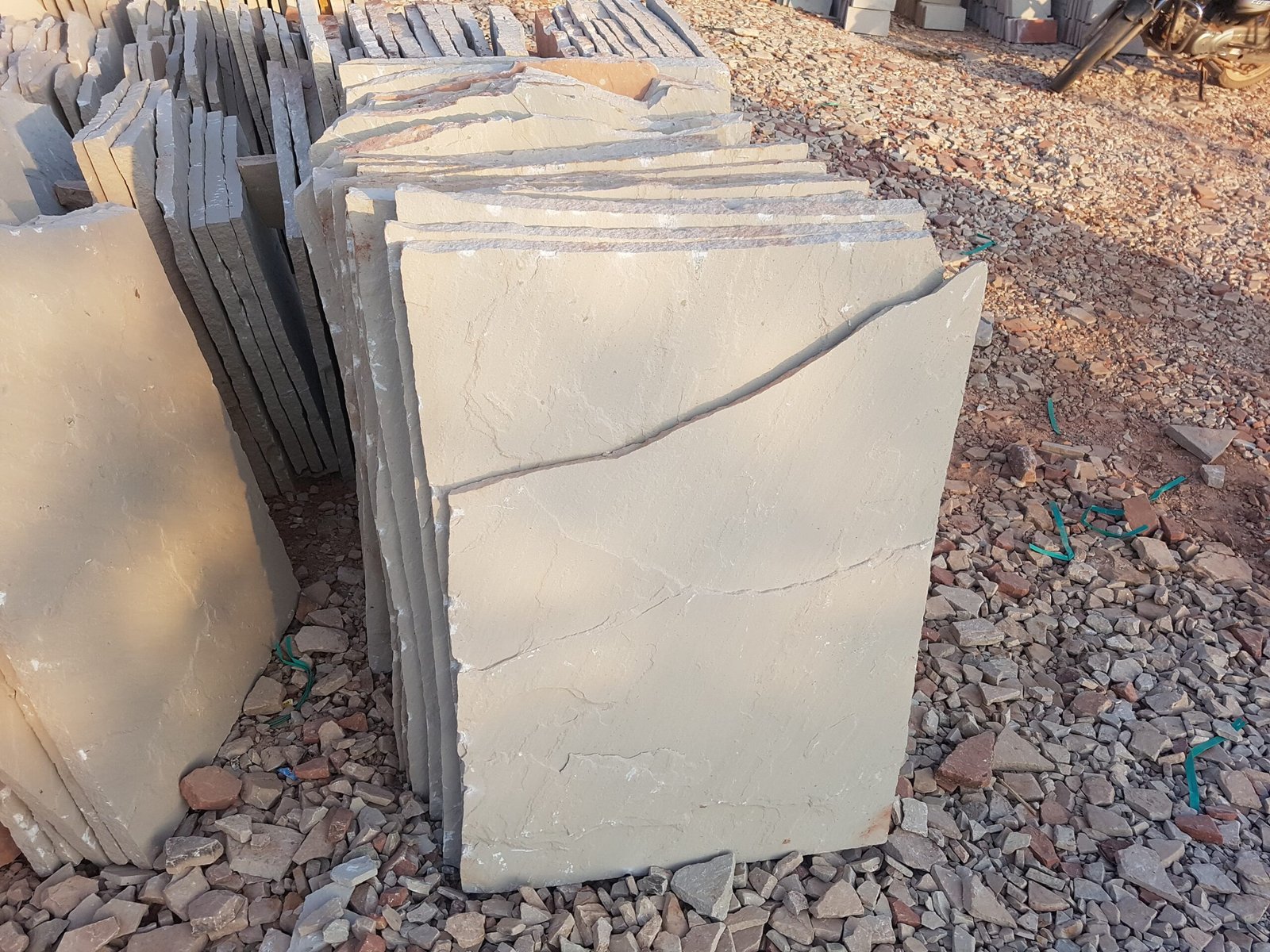 What is the price of Dholpur beige sandstone per square foot?
